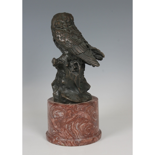 32 - Miguel Fernando L¢pez 'Milo' (b.1955) A bronze figure of two owlson rock, red ashlar marble plinth, ... 