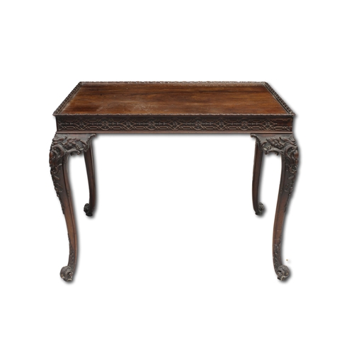 60 - A George III carved mahogany silver tablethe rectangular top with fretwork above a carved frieze on ... 