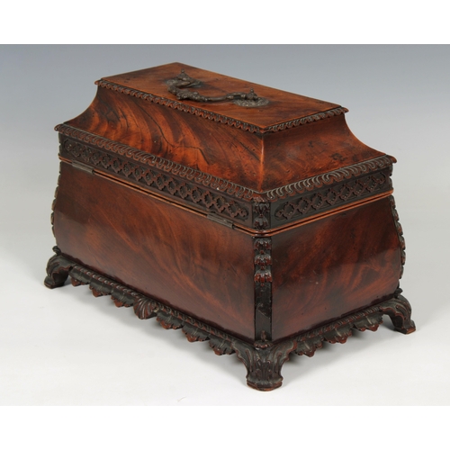 69 - A George II mahogany tea caddyof bombe sarcophagus form with foliate bracket feet, the interior late... 