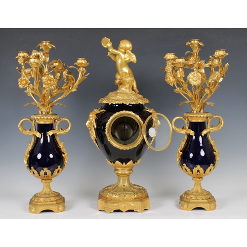 254 - A 19th century French ormolu and blue porcelain clock garniture by Raingo Freres Paristhe deep blue ... 