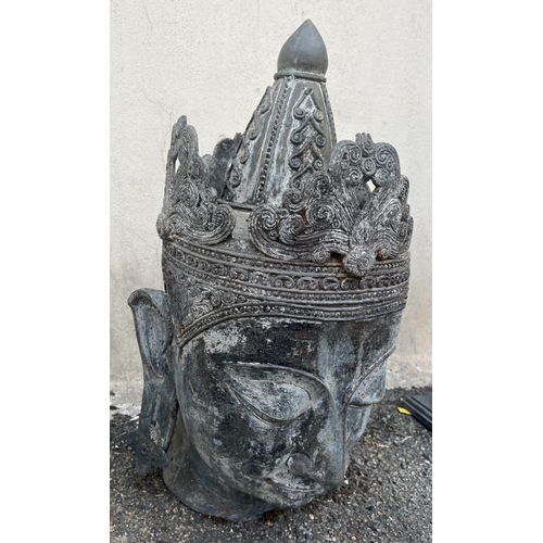 267 - Garden statuary - A metal Tibetan buddha head62cm. high.