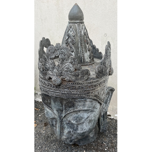 267 - Garden statuary - A metal Tibetan buddha head62cm. high.