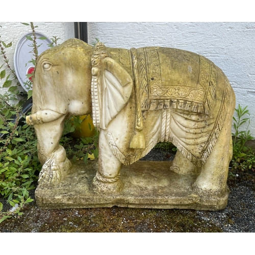 268 - Garden statuary - A pair of large and heavy carved white marble Indian elephantsraised on rounded re... 