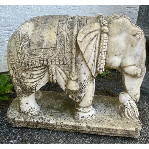 268 - Garden statuary - A pair of large and heavy carved white marble Indian elephantsraised on rounded re... 