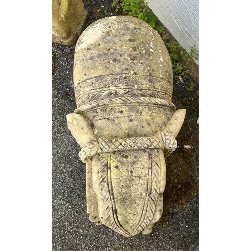 268 - Garden statuary - A pair of large and heavy carved white marble Indian elephantsraised on rounded re... 