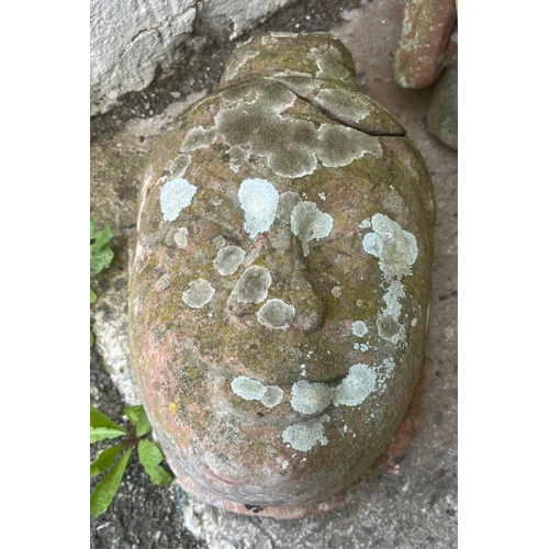 271 - Garden statuary - A weathered terracotta Buddha head42cm. high, together with a smaller head. (2)