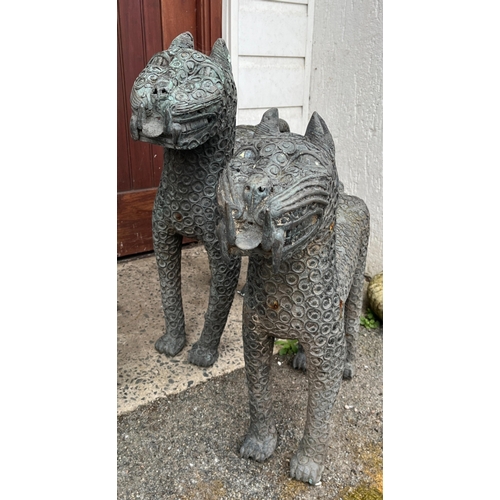 272 - Garden statuary - A pair of stylised metal leopard figuresmodelled in a standing pose, 101cm. long a... 