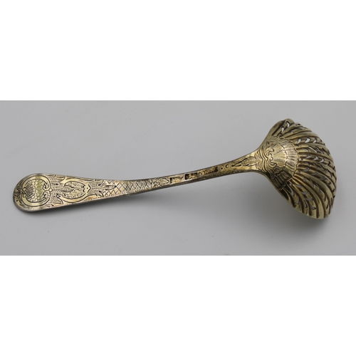 288 - A Georgian silver gilt bright cut sifter spoonHester Bateman, London, no date letter, the handle fan... 