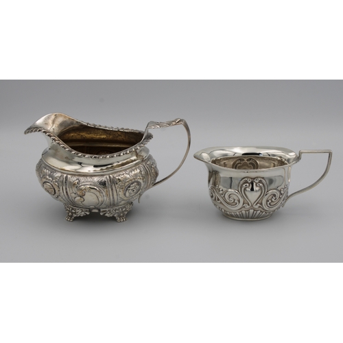 308 - A George IV silver jugWilliam Stroud, London, 1826, of oval form with repousse decorated flower head... 