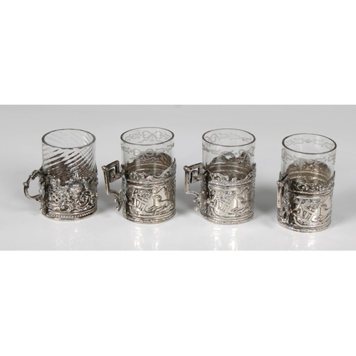 319 - Three silver tot glass holdersChester import marks for B Muller & Son (Berthold Muller), 1906, embos... 