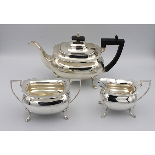 327 - A three piece silver tea serviceWalker & Hall, Sheffield, 1912, of oval bellied form, comprising of ... 