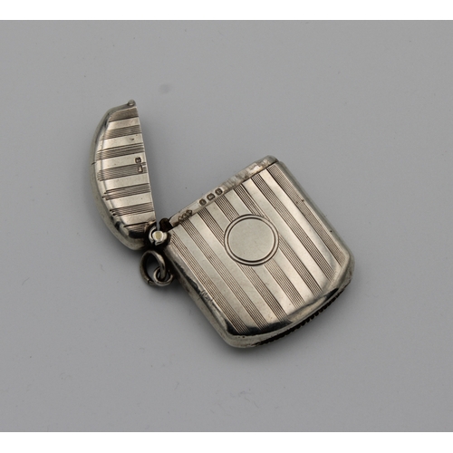 335 - A George V silver vesta caseSmith & Bartlam, Birmingham, 1918, of rounded rectangular form with engi... 