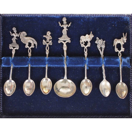 357 - A cased set of twelve 800 silver demitasse / coffee spoonshaving various terminals / finials, to inc... 