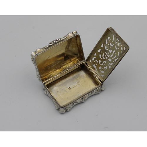 387 - A Victorian silver shaped rectangular vinaigretteNathaniel Mills, Birmingham, 1851, all over foliate... 