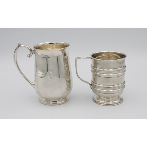 397 - A George V silver baluster christening mugof plain polished form, scroll handles, spreading circular... 