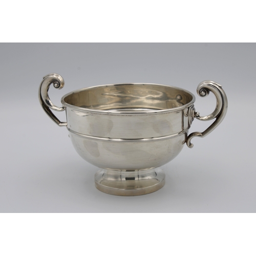 398 - A George V silver twin handled trophy cupscroll twin handles, plain polished bowl, spreading circula... 