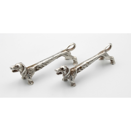 422 - A pair of silver figural knife rests in the form of elongated DachshundsW BROS, Sheffield, 1973, 7.7... 