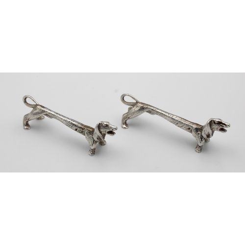 422 - A pair of silver figural knife rests in the form of elongated DachshundsW BROS, Sheffield, 1973, 7.7... 