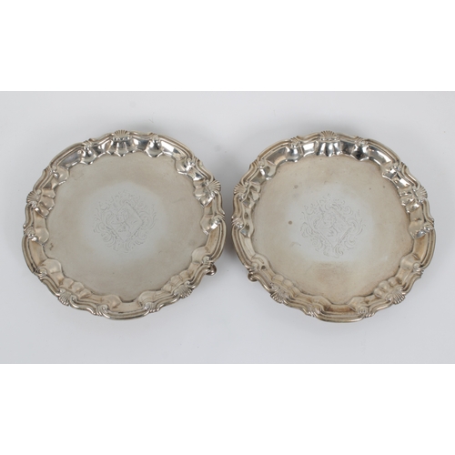 430 - A pair of George II silver card waitersWilliam Peaston, London, 1749/50, of typical forms with shell... 