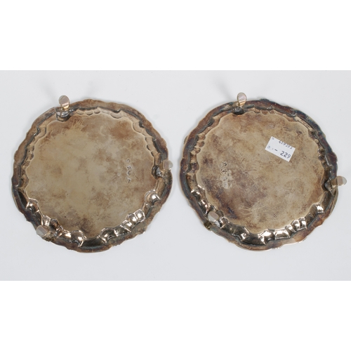 430 - A pair of George II silver card waitersWilliam Peaston, London, 1749/50, of typical forms with shell... 