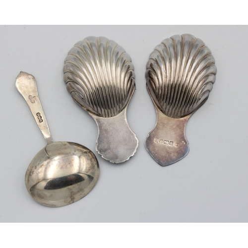 446 - Two silver caddy spoonsby Francis Howard Ltd, two of scallop shell form, together with another, 1.95... 