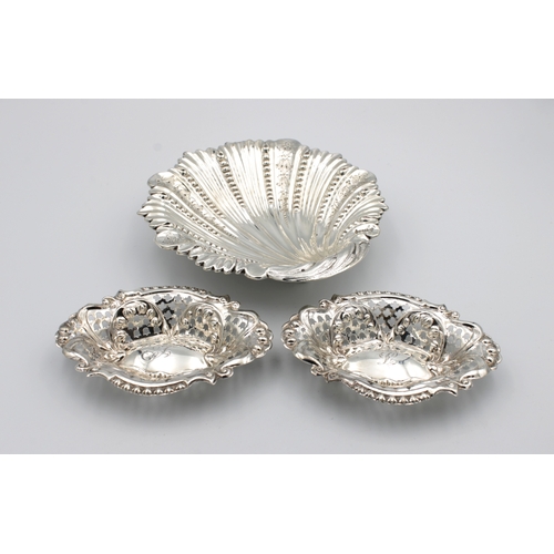 455 - A silver scallop shell dishW W Harrison & Co, Sheffield,1895, raised on three ball feet,16.5cm. wide... 