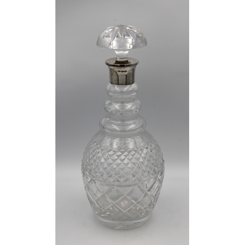 515 - A silver mounted clear cut glass decantermaker's mark "IF & Son Ltd", 30cm. high.