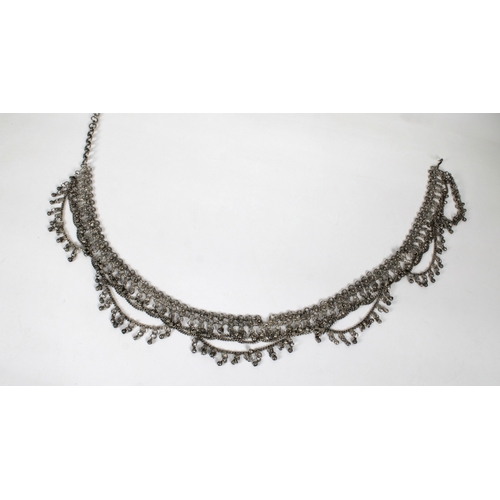 544 - A silver toned white metal chain Kuchi style belly dancer's beltIn a classic form with extendable ch... 