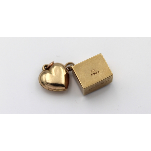 578 - Two 9ct gold charmsto include a cased 10 Shilling banknote and a love heart. (2)