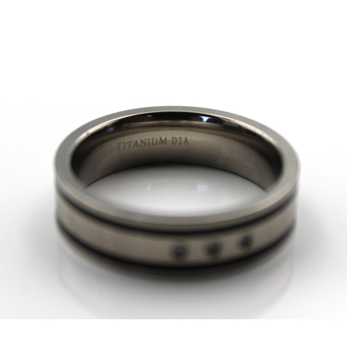 588 - A titanium and three stone diamond gents ring / wedding bandsize Z.