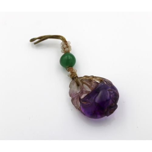 593 - A Chinese carved Amethyst Gourd Pendant.