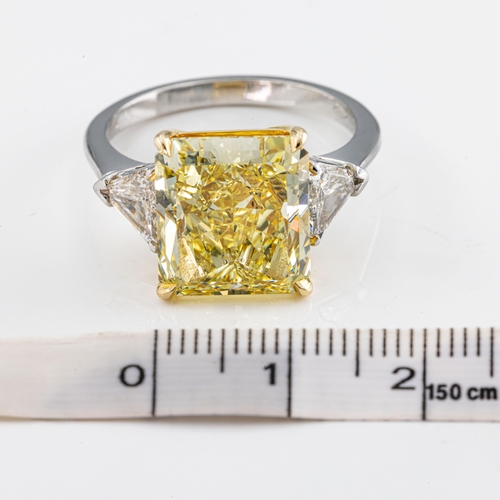 666 - A stunning natural yellow solitaire diamond ringthe cut cornered rectangular modified brilliant-cut ... 