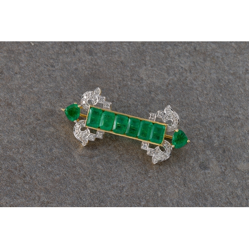 703 - An Art Deco style yellow metal emerald and diamond bar broochset with mixed cut emeralds approximate... 