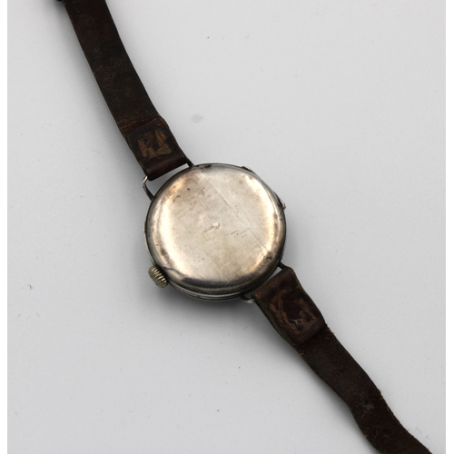 741 - A silver cased trench watchthe round enamel dial with Roman numerals, subsidiary dial, brown leather... 