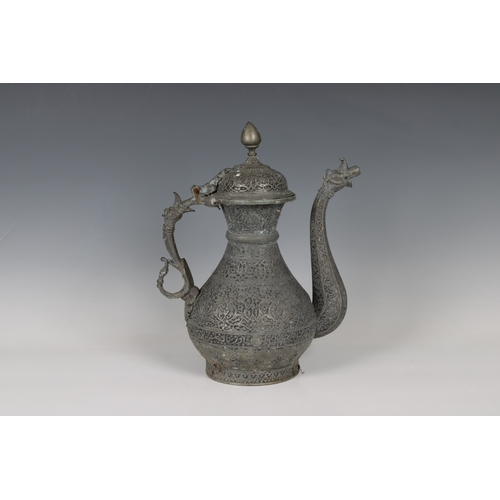 772 - A large Islamic or Middle Eastern heavy cast metal / bronze ewer decorated with mythical beasts with... 