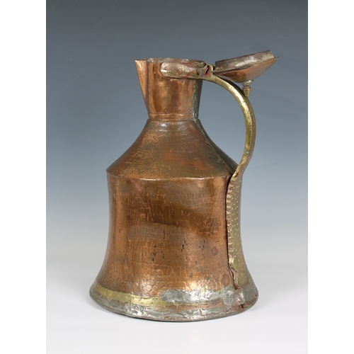 775 - A large Islamic / Persian copper and brass water jugprobably 19th century, of waisted cylindrical fo... 