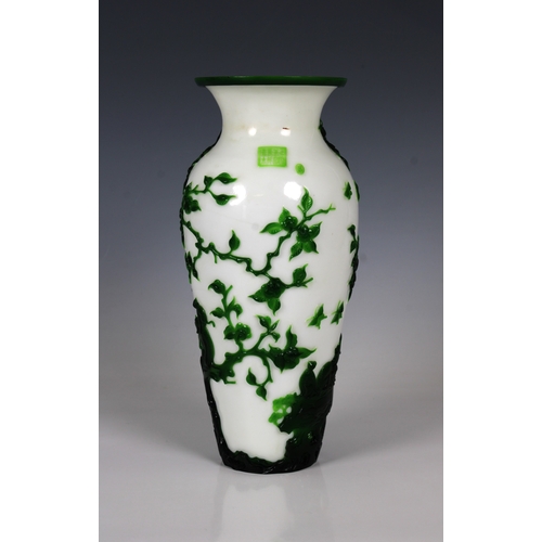 783 - A Peking Green Overlay Opaque White Glass Vase19th/20th Century, decorated with scenes of monkeys at... 