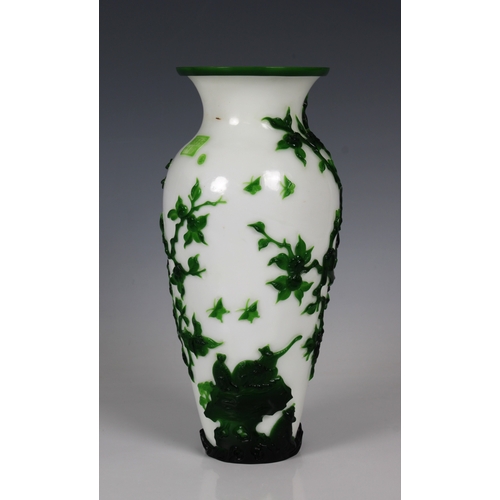 783 - A Peking Green Overlay Opaque White Glass Vase19th/20th Century, decorated with scenes of monkeys at... 