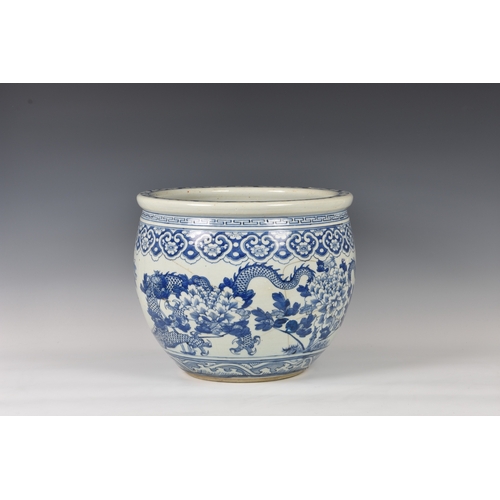 791 - A Chinese blue and white porcelain fish bowl19th century, circular form, painted with two long bodie... 