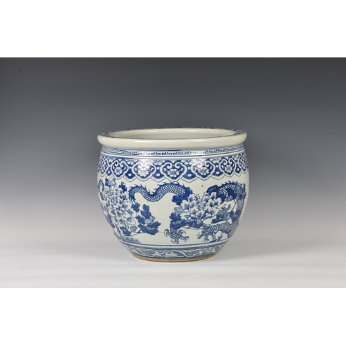 791 - A Chinese blue and white porcelain fish bowl19th century, circular form, painted with two long bodie... 