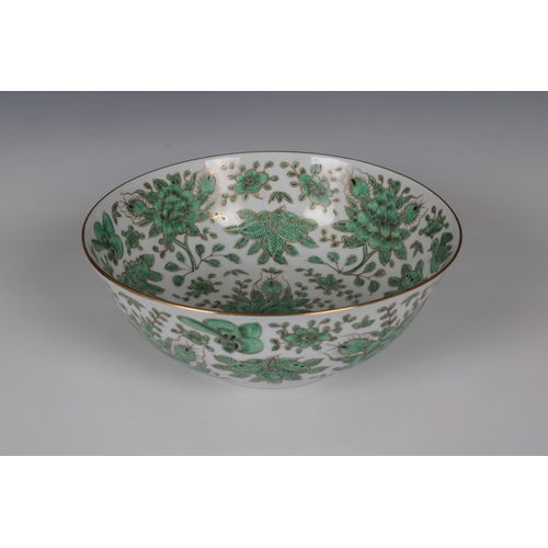 800 - A modern Chinese porcelain footed bowldecorated in green with flora and fauna and gilding, marked be... 