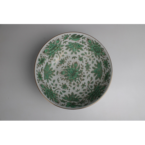 800 - A modern Chinese porcelain footed bowldecorated in green with flora and fauna and gilding, marked be... 