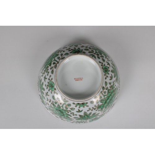 800 - A modern Chinese porcelain footed bowldecorated in green with flora and fauna and gilding, marked be... 