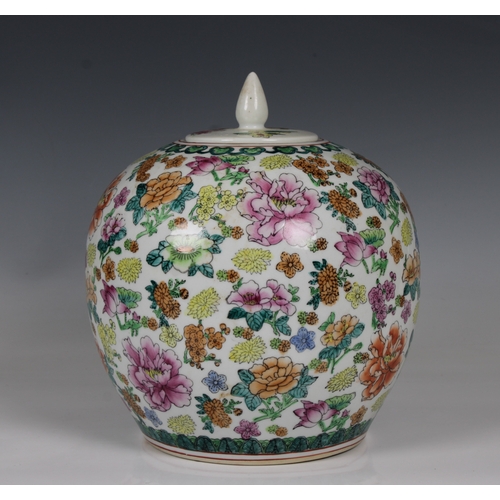 807 - A modern Chinese ginger jar and coverwith all over floral displays, 25cm. high.