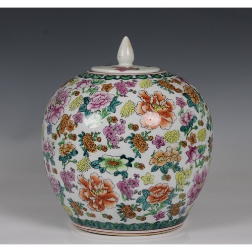 807 - A modern Chinese ginger jar and coverwith all over floral displays, 25cm. high.