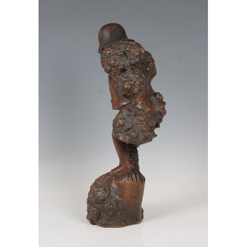 831 - A carved wooden Oriental root figure of an old man with a gourd leaning on a stick33cm. high.