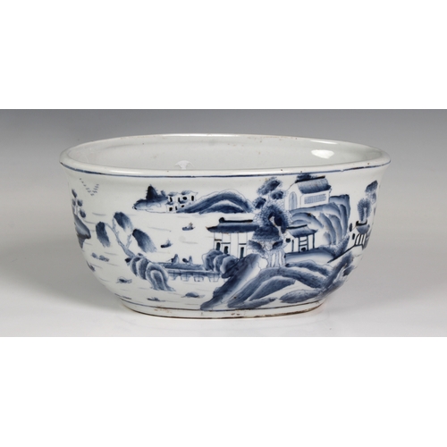 833 - A Chinese blue & white oval bowl / dishdecorated with a town landscape, the inner with carp, blue fo... 