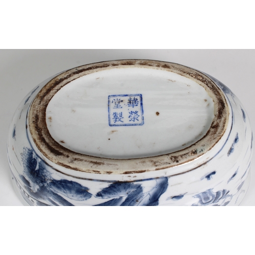 833 - A Chinese blue & white oval bowl / dishdecorated with a town landscape, the inner with carp, blue fo... 