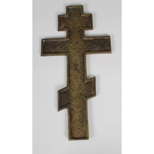 1031 - A 19th century bronze Russian Orthodox cross with a central figure of Christ to a blue enamelled gro... 