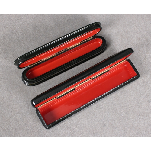 1036 - Two 20th century Russian lacquered boxesof elongated rectangular and oval form, the hinged covers de... 